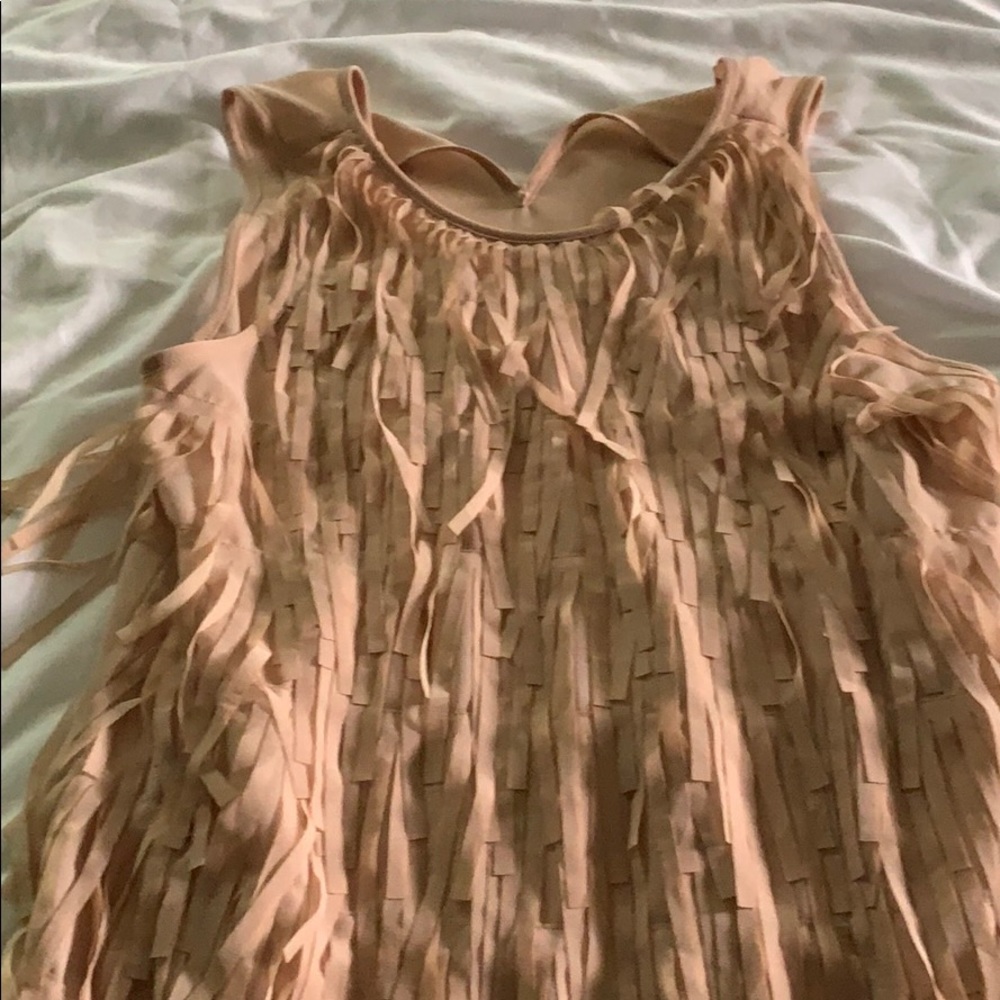 Sleeveless slinky top with fringe.